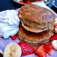 Pancakes with whip cream banana and strawberries at Pancake District in Dordrecht