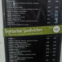 Menu with sandwiches. Green dots are vegan. at Foods of the Mediterranean in Allentown