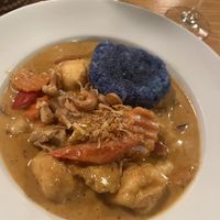 Massaman curry with butterfly pea sticky rice   at Plants of Roselyn in South East London