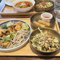 Pad Thai lunch tray - Pineapple curry lunch tray in the back  at Plants of Roselyn in South East London