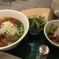 Bamboo shoot ramen with side of faux meat and pickled veggies at T's Tantan - Tokyo JR Station in Tokyo
