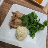 Side of mock meat, vegan cheese, and corriander at T's Tantan - Tokyo JR Station in Tokyo