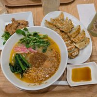 Golden sesame ramen with gyozas and soy meat plus a lemon drink at T's Tantan - Tokyo JR Station in Tokyo