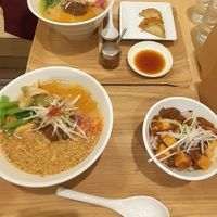 White sesame ramen set meal with gyoza and golden sesame ramen set meal with tofu curry. at T's Tantan - Tokyo JR Station in Tokyo
