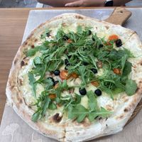 Chef vegan pizza with rocket, olives and mushrooms  at La Bufalina Ibiza in Ibiza