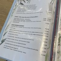 Menu… Meat, fish… 😢😏  at Veganissimo in Santorini