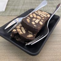 Complimentary chocolate biscuit orange dessert  at Veganissimo in Santorini