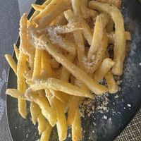 Chips with vegan cheese (similar to Parmesan!)  at Veganissimo in Santorini