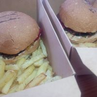 Take away (burgers with fries) at Veganissimo in Santorini