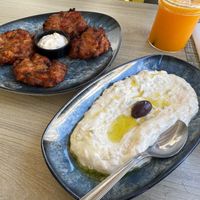 Homemade traditional greek tomato balls and vegan tzaziki  at Veganissimo in Santorini