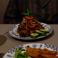 Fried noodles and fried spring rolls at Thong Dong Vegan Kitchen & Cafe in Lao Cai