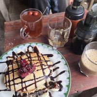 Vegan pancakes, ginger tea with dried apple  at Thong Dong Vegan Kitchen & Cafe in Lao Cai