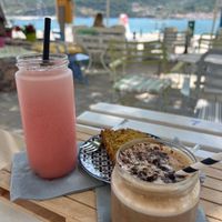 Banana Frozen Cappicino (requested oat milk) was so delicious and creamy. Tasted like a milkshake!

Wasn’t keen on poppy cake at first but was so nice we ordered another slice! at Juices & Books in Skopelos