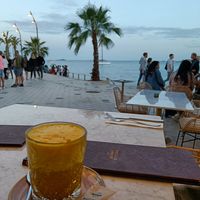 Kurkuma latte and the sea at The Skinny Kitchen - Eivissa in Ibiza