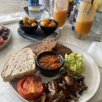  Vegan breakfast with sweetcorn fritters, sourdough , home made beans, tomato, mushrooms with a side of mini hash browns   at The Skinny Kitchen - Eivissa in Ibiza