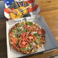 Pizza with vegan cheese, onions, tomatoes, and bell pepperss  at Mattenga's - Sea World in San Antonio