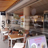 Outdoor seating at Sri Veda in Basel
