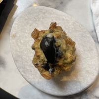 Amuse-bouche made with black garlic instead of honey!   at Cucù in Vicenza