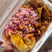 Vegan goat curry, rice, Dumpling and coleslaw at Michaels Caribbean Storehouse in Wolverhampton