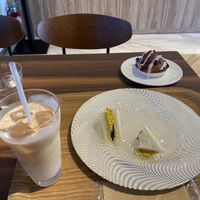 A sweet vegan soy milk tea, cinnamon roll, and the eggless sandwich that will eaten soon  at MERCY Vegan Factory in Osaka