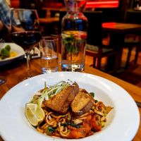STIRFRIED VEGETABLES,
EDAMAME BEANS WITH
ORGANIC NOODLES, COOKED
WITH FRESH GINGER AND
GARLIC SPICES, SESAME
TATOSAUCE AND TOPPED
TH HOME SMOKED TOFU at David Bann Restaurant in Edinburgh