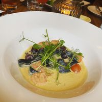 Black pappardelle - Homemade black pappardelle pasta cooked with asparagus, cherry tomatoes and black olives in a creamy smoked cheese sauce. Topped with dehydrated capers. [vg]  at David Bann Restaurant in Edinburgh