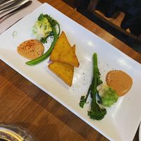 Coconut polenta with tikka massala cream and spiced brassicas [vg]  at David Bann Restaurant in Edinburgh