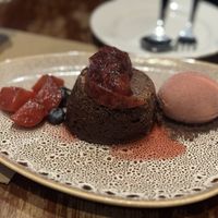 Chocolate cake dessert with raspberry ice cream  at David Bann Restaurant in Edinburgh