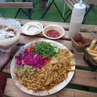 Shawarma plate, shawarma pita, chips, falafel, hummus at Falafel Sumsum in Tel Aviv