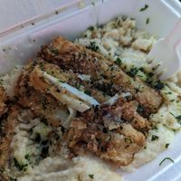 Fried fsh and grits at Creole Hidden Garden in Lake Charles