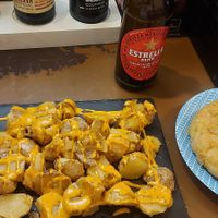 Patatas bravas and tortilla de patatas with chickpea flour at El Miau De Fucar in Madrid