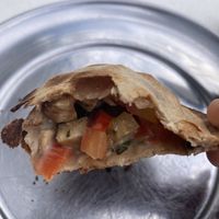 Empanada de tofu, tomate y “queso"  at Coma Veggie in Buenos Aires