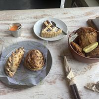 Tofu empanada, vegan bacon empanada, tart, and fried tofu   at Coma Veggie in Buenos Aires