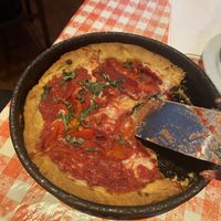 Deep dish with basil and roasted red peppers  at Gino's East - South Loop in Chicago