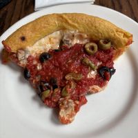 Slice of vegan deep dish pizza   at Gino's East - South Loop in Chicago