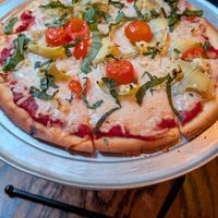 Here's a gluten-free vegan pizza with their typical amount of cheese at Gino's East - South Loop in Chicago