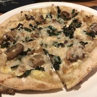 Vegan kale mushroom pizza - had an excellent white sauce base abs cashew cheeze  at Earls Kitchen + Bar in Toronto