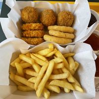 Fries and 9-pack with nuggets, onion rings and Dutch originated balls (forgot the name).  at The Sunny Burger Co. in Amsterdam