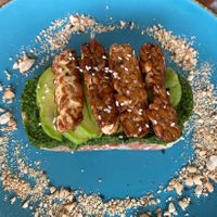 Pesto avocado tempeh toast!  at Nyom Nyom in Tibubeneng