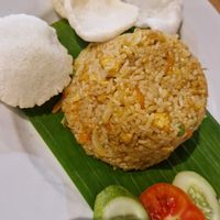 Nasi goreng. The crackers are made with wheat and garlic at Firda Warung in 