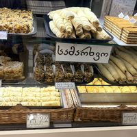Everything in this photo  is vegan. The cigarettes are the same and the baklava is the same flavor, just two different shapes, so six unique vegan items.   at Dona Bakery and Sweets in Batumi