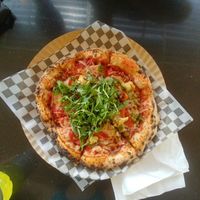 Ricotta Pesto: cheese, red pepper, pesto, tomato sauce & cherry tomatoes, baby arugula, balsamic sauce at Rawr Goods in Panama City