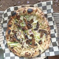 Magic Mushrooms: white cheese sauce, zucchini ribbons, roasted Mushrooms, caramelised onions, garlic, black truffa oil drizzle at Rawr Goods in Panama City