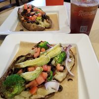 Justaspud with all the free toppings plus avocado on the front one. at McAlister's Deli in Cedar Park