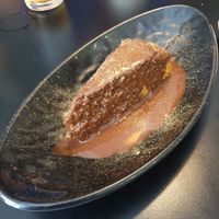 Orange spelt cake covered in chocolate sauce at La Cuina del Cel in Mataro
