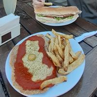 Milanesa napolitana y sánguche de lomito. at Don Simón in Buenos Aires