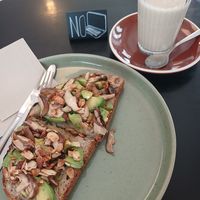 Avocado and mushroom toast + glass of oat milk at OBBA Café in Almada