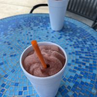 Strawberry slushies, so refreshing, perfect eating space outside and right off 95 for vegan travelers.  at Cultural Kitchen Catering in Jacksonville