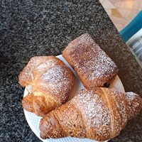 simple croissant, one with chocolate filling and the other with orange cream. All amazing! at Costadoro Coffee Lab in Turin