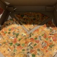 Tyrannosaurus pizza with vegan cheese  at Pizzasaurus in Cape Town